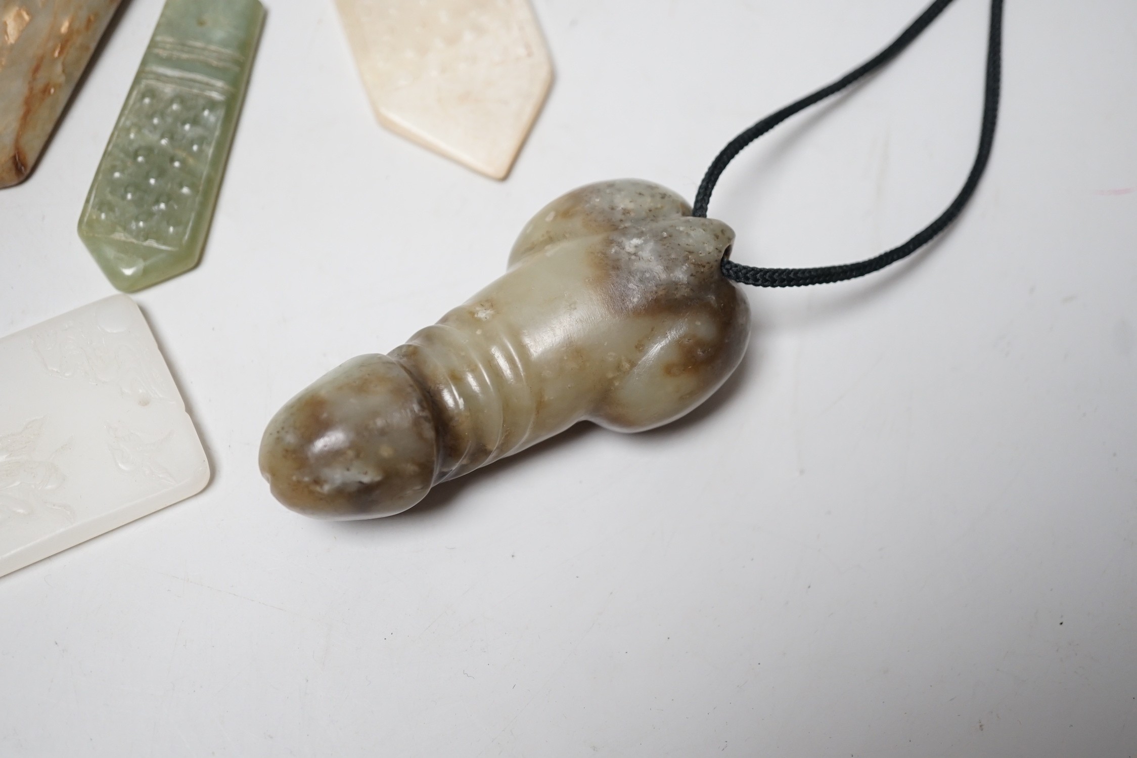 A group of various Chinese jade carvings and a white glass plaque